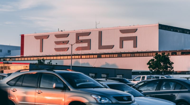 Electric and petrol cars sat in tesla parking lot