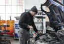 Is The RAC Car Inspection Worth The Money? Let’s find out mechanic checking oil level on the car which is in the workshop