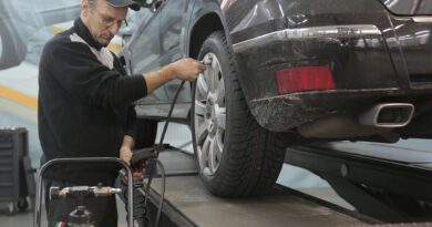 Person performing car inspection to save customer money